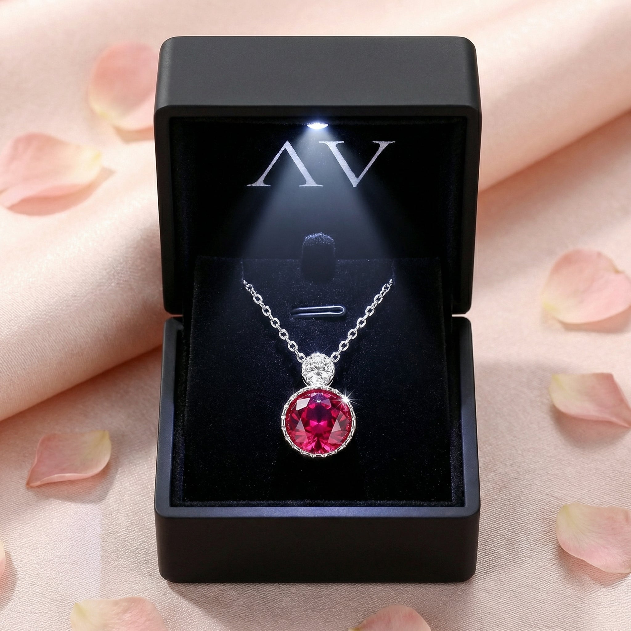 S925 sterling silver round-cut simulated pink tourmaline pendant necklace inside a black LED-lighted gift box.