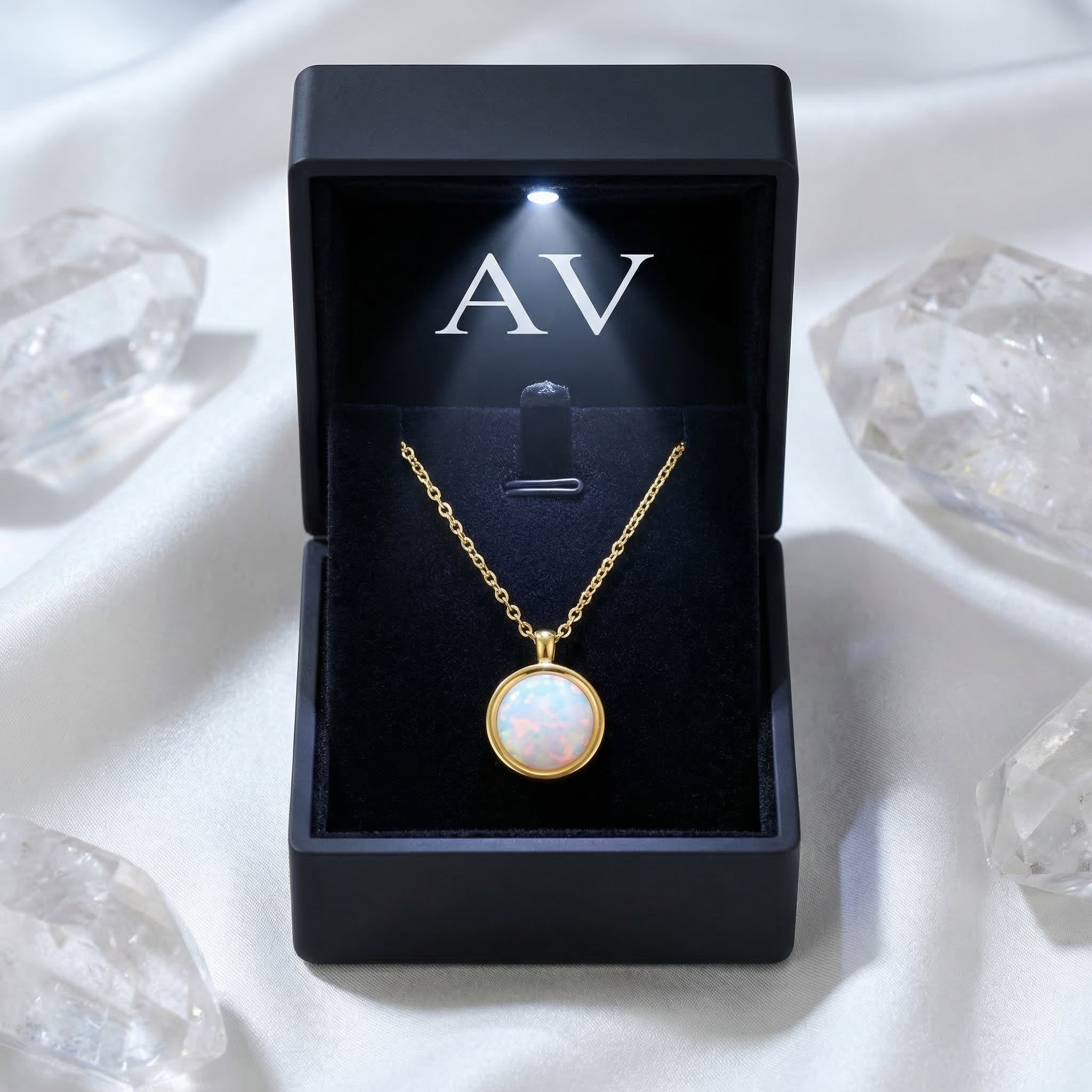 Gold finish round cut white opal necklace presented in a black LED-lit jewelry gift box.