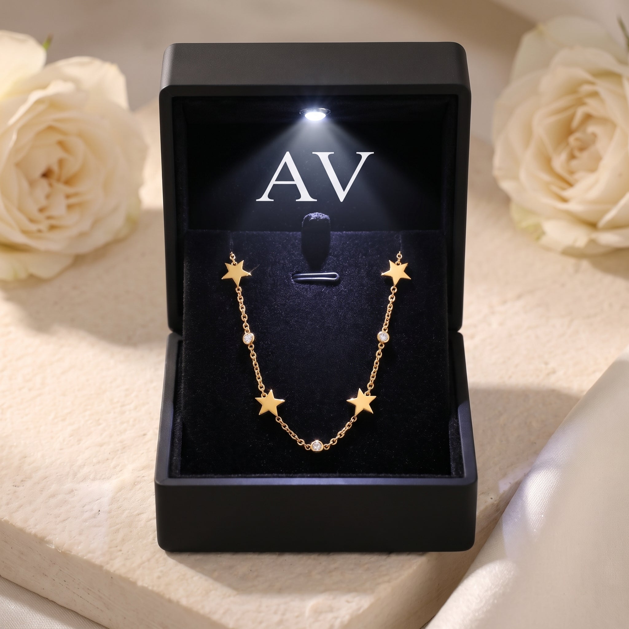 18K gold star necklace with simulated diamonds inside a black LED-lit jewelry gift box.