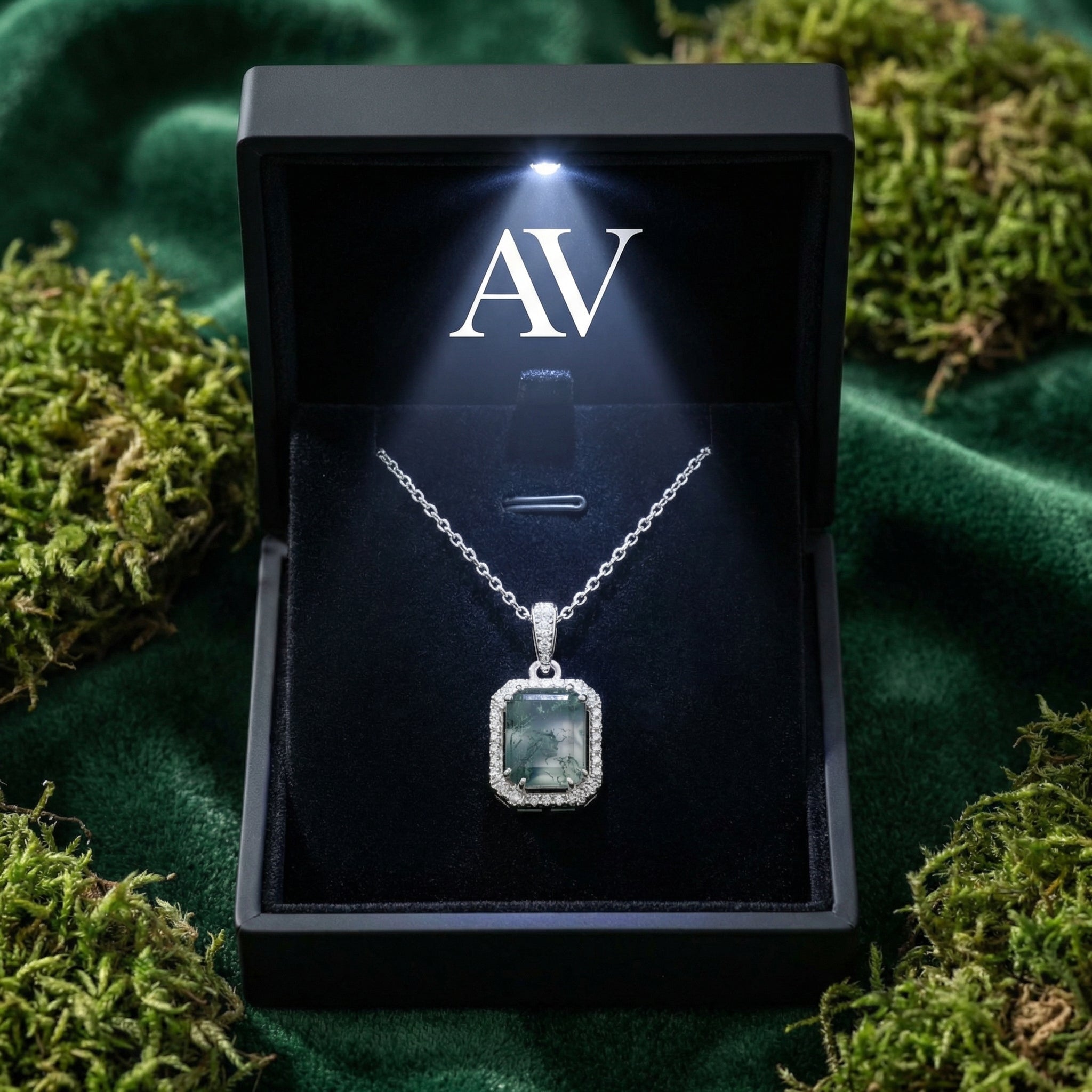 Rectangular moss agate pendant necklace in S925 sterling silver presented in a lighted black AV branded gift box.