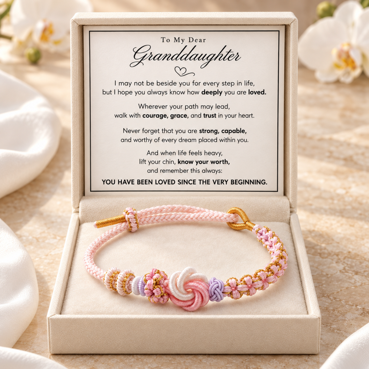 Pink and lavender knotted cord bracelet in the included To My Dear Granddaughter message-card gift box
