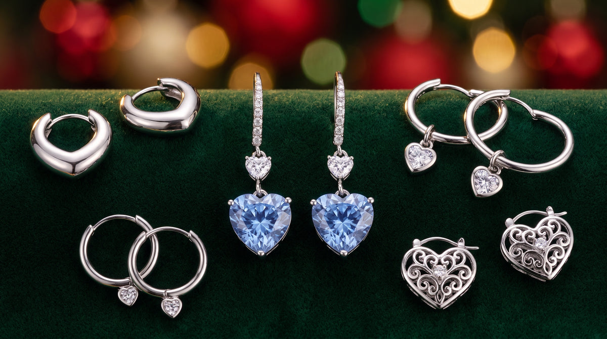 Illustrative silver-tone heart earrings on green fabric with blurred holiday lights; not a verified depiction of the recommended products.