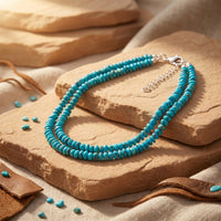 Double strand turquoise bead necklace with silver clasp on desert stones.