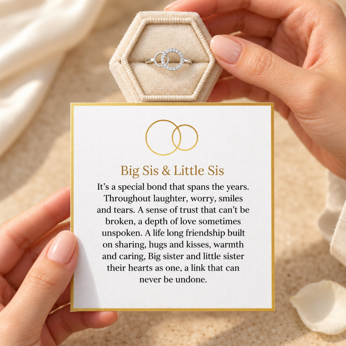 Silver interlocking circle ring with the included Big Sis & Little Sis message card