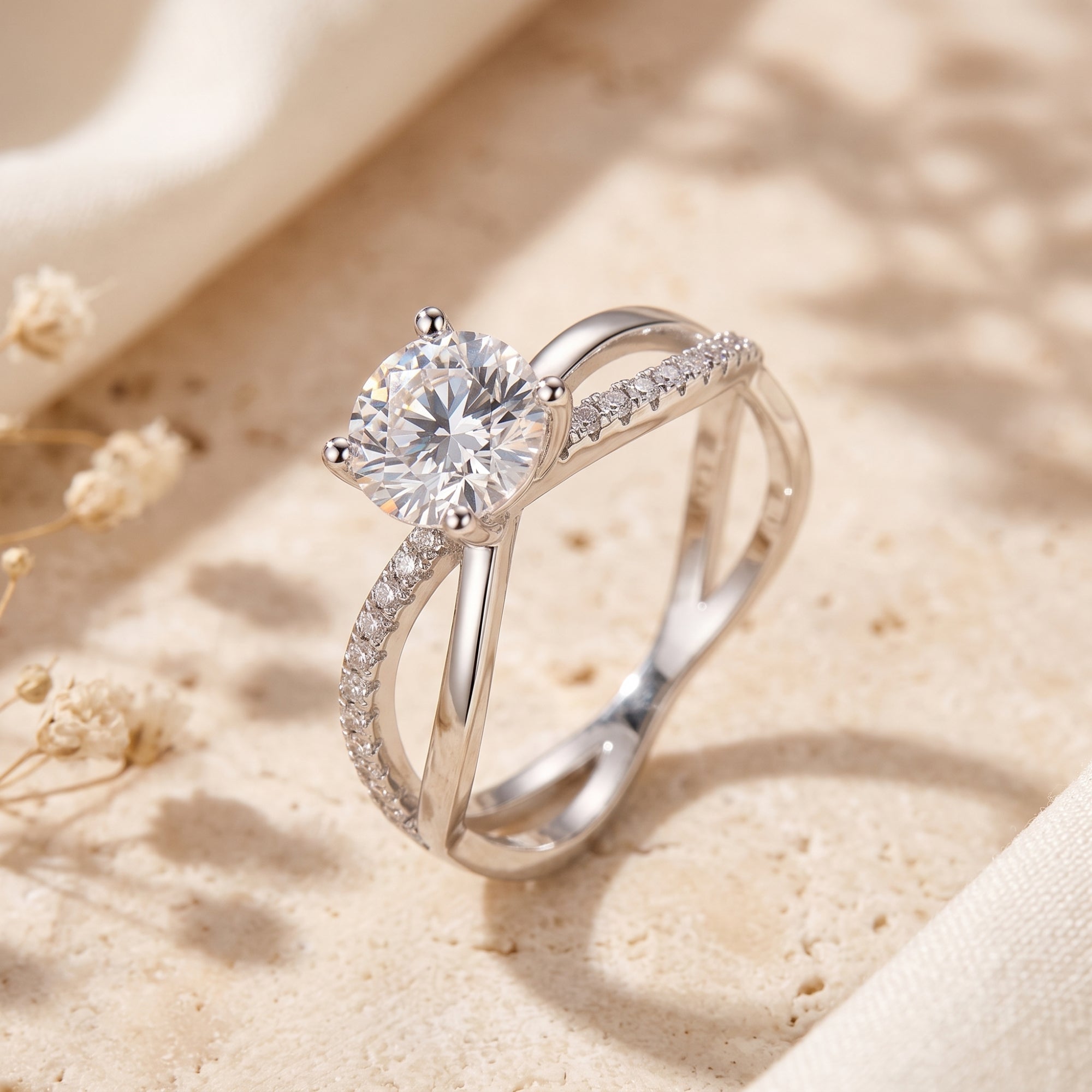 Sterling silver crisscross solitaire ring with round cubic zirconia on stone.