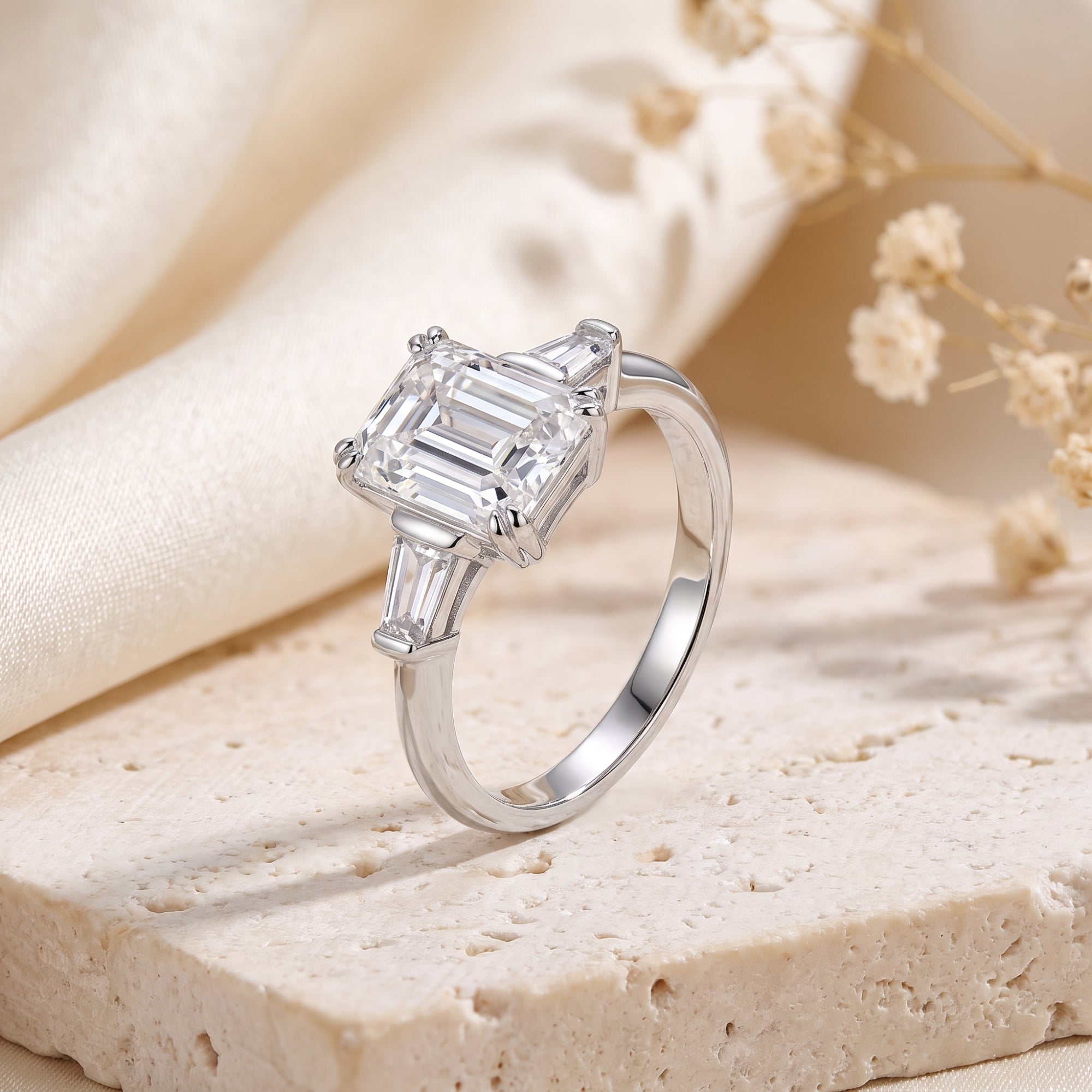 S925 sterling silver emerald cut cubic zirconia ring on a stone lifestyle background.