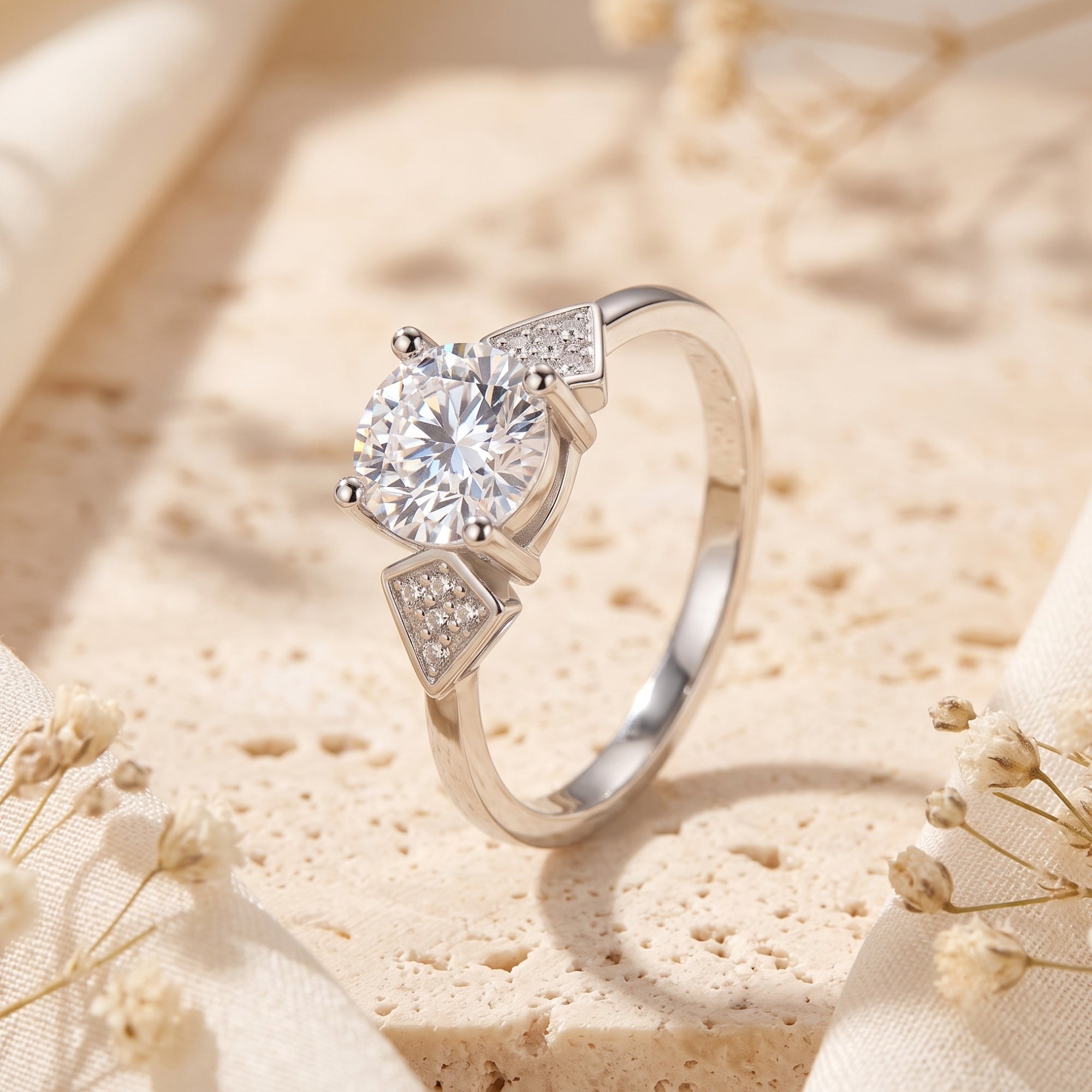 Trinity S925 silver ring with round brilliant stone on stone background.