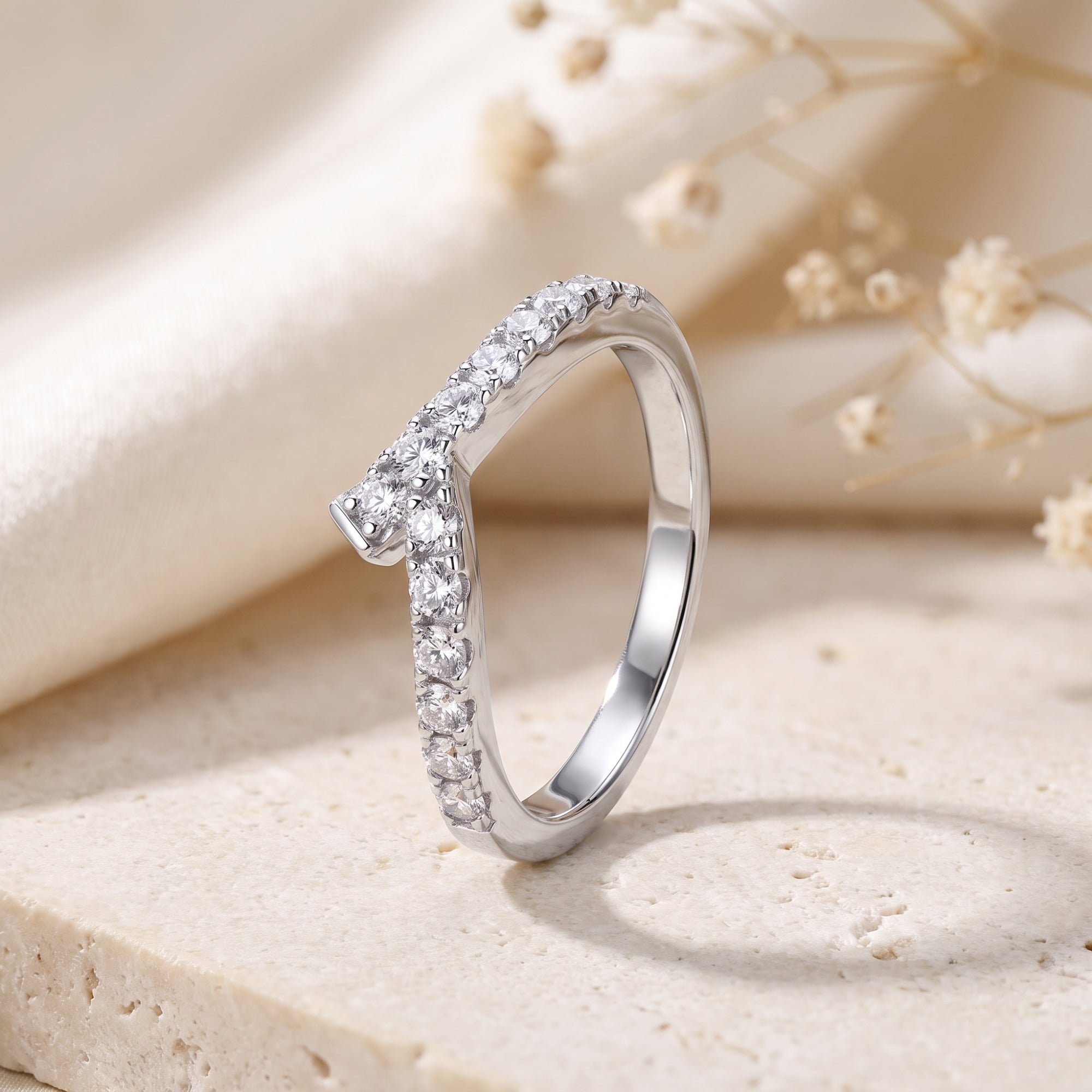 S925 silver asymmetric chevron ring with pave cubic zirconia on stone.