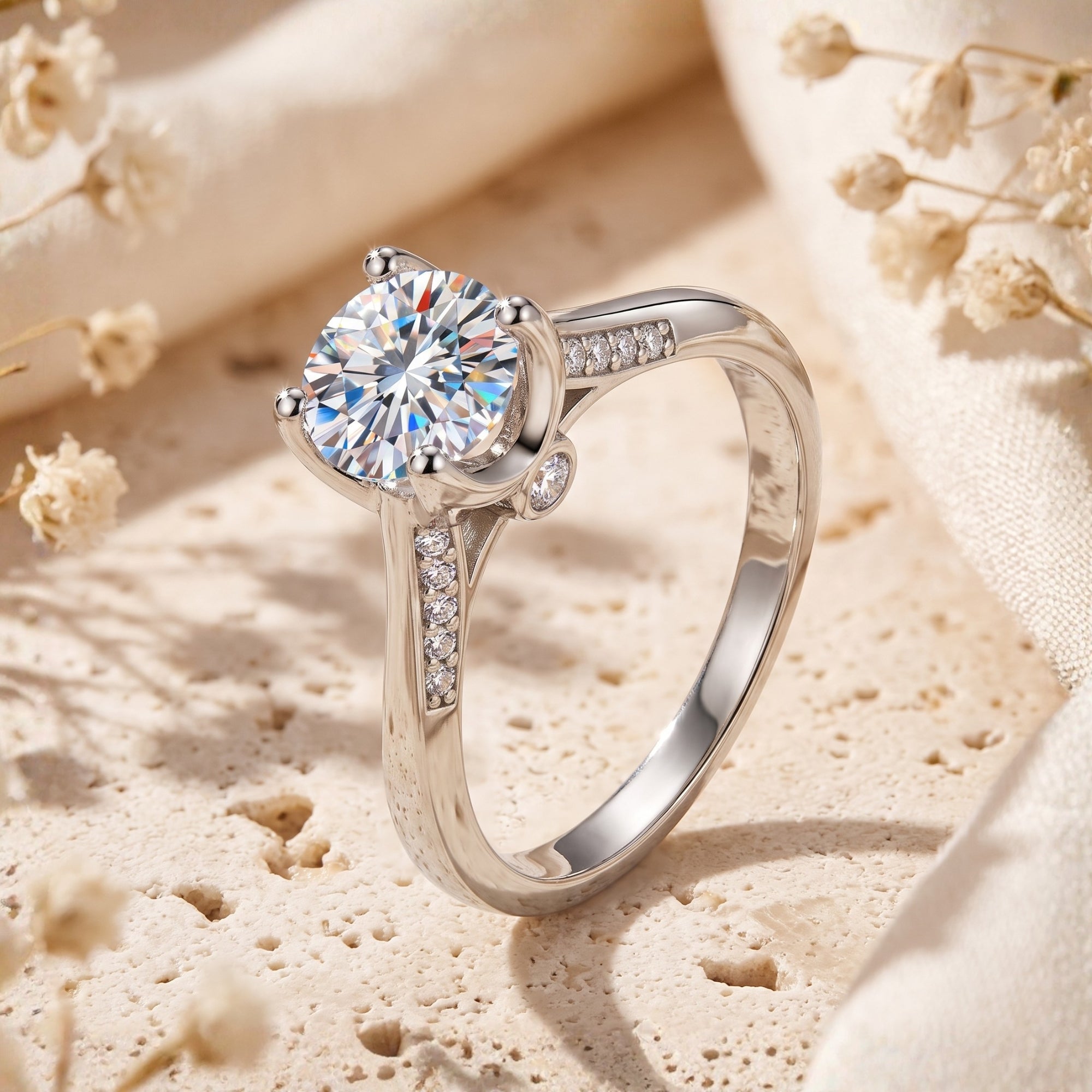 Round CZ silver solitaire ring on textured lifestyle background.