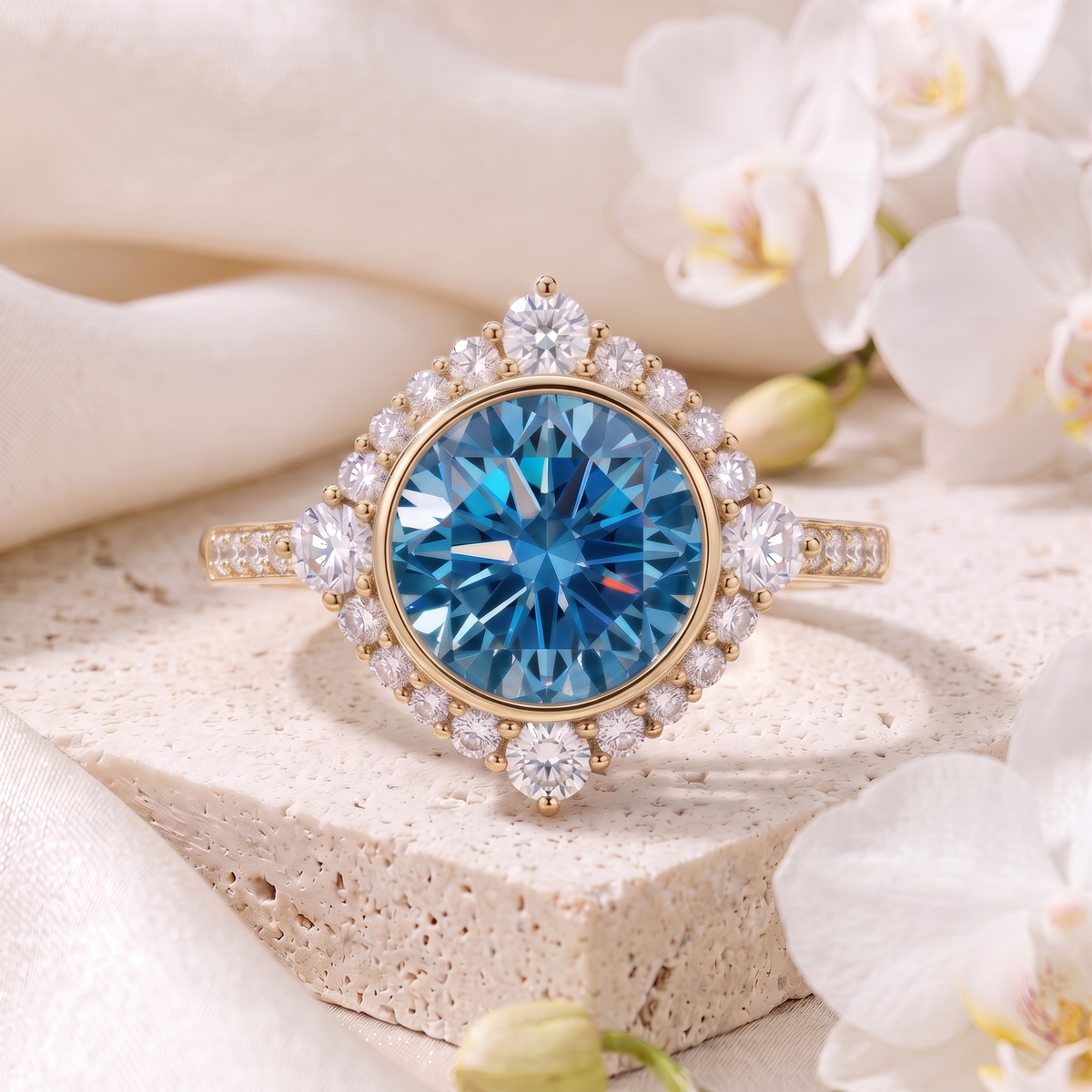 Round cut blue moissanite statement ring with geometric diamond halo in yellow gold.