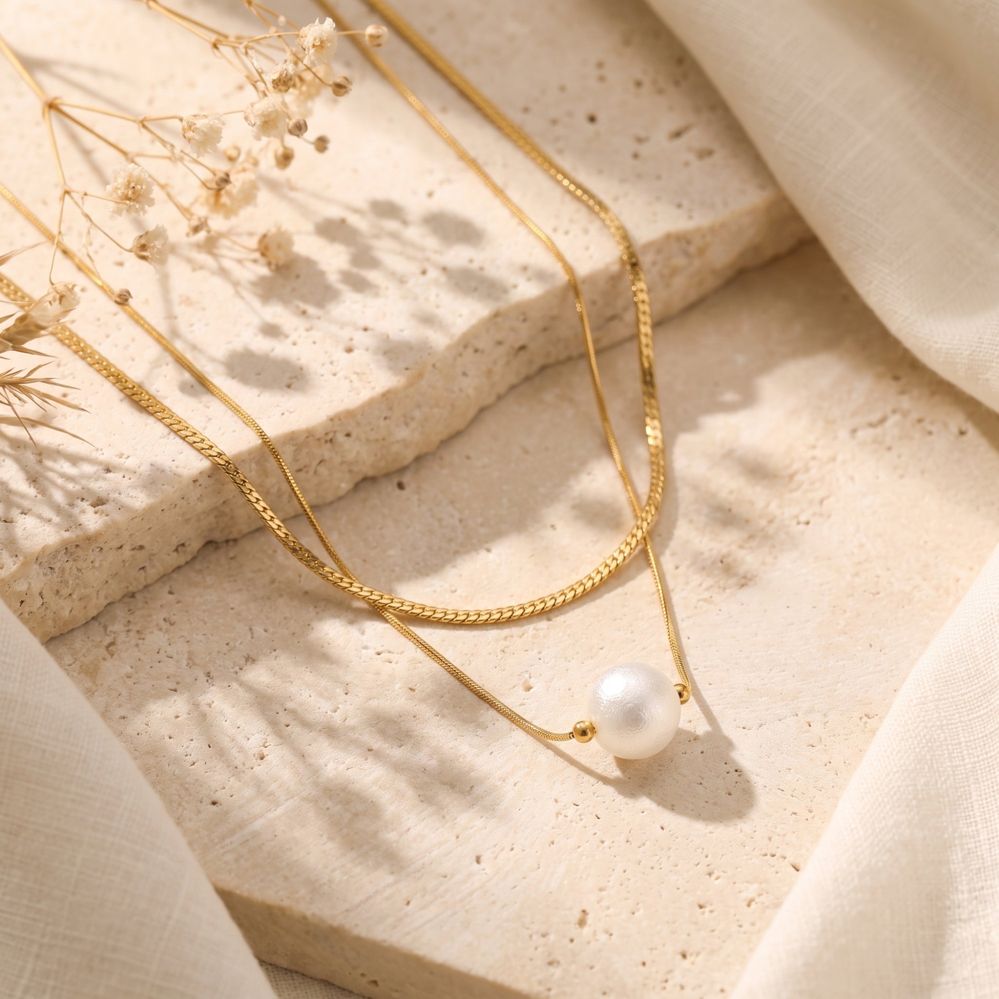 El collar de perlas en capas