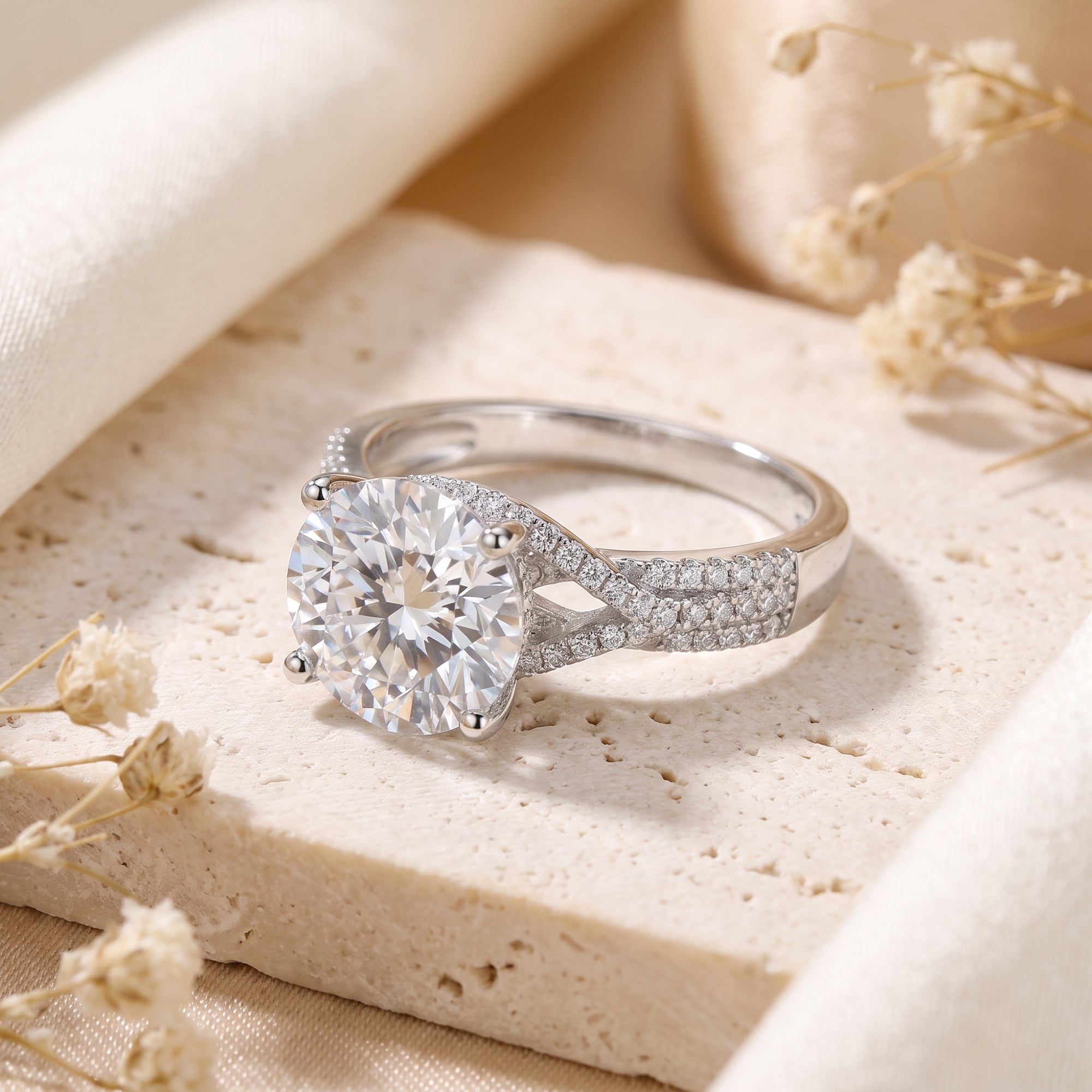 Twisted sterling silver solitaire ring with round cubic zirconia on stone.