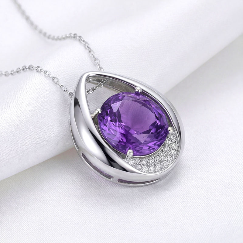 Close-up of the S925 sterling silver Isolde drop necklace featuring a vibrant round cut simulated amethyst.