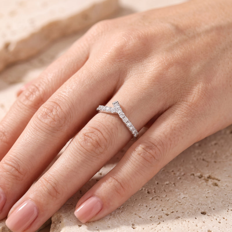 Top view of S925 silver asymmetric chevron ring with pave cubic zirconia on hand.