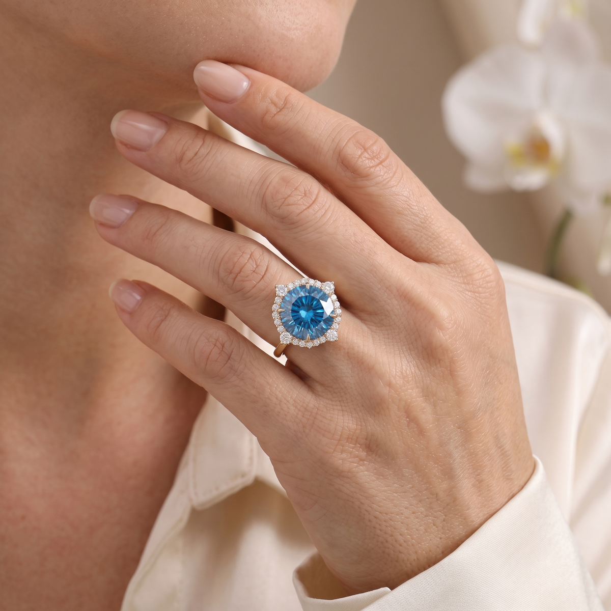 Model wearing a rose gold blue moissanite halo ring on her hand.