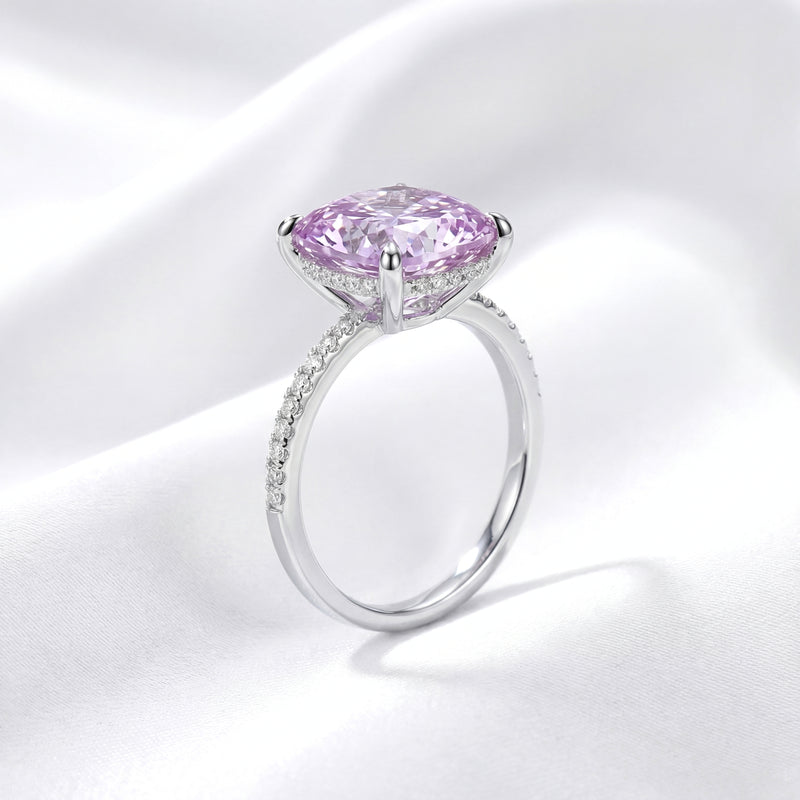 Side profile of the Ariadne halo ring with a cushion cut simulated amethyst and pavé sterling silver band.