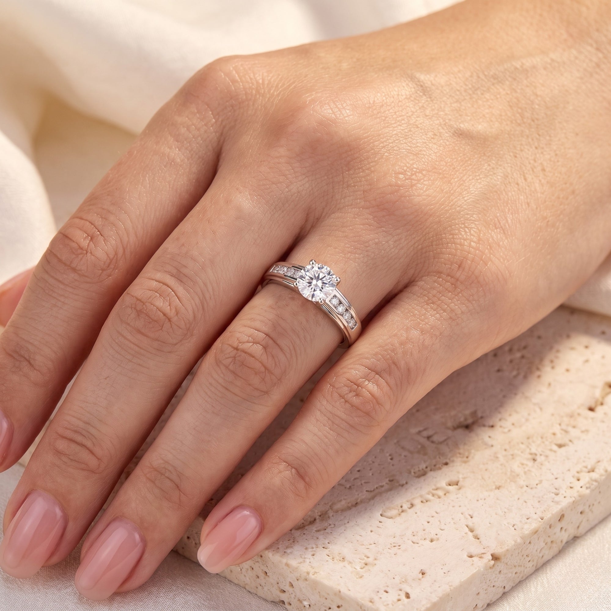 S925 sterling silver crossover cathedral ring with a round simulated diamond worn on a woman's hand.