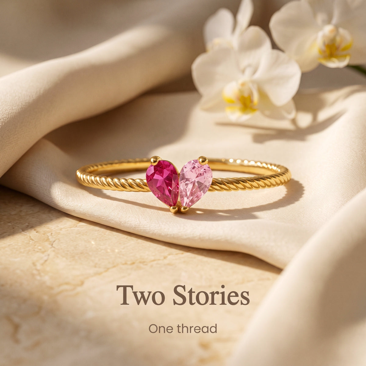 Gold vermeil open heart ring with two pear-shaped example birthstone-colour stones