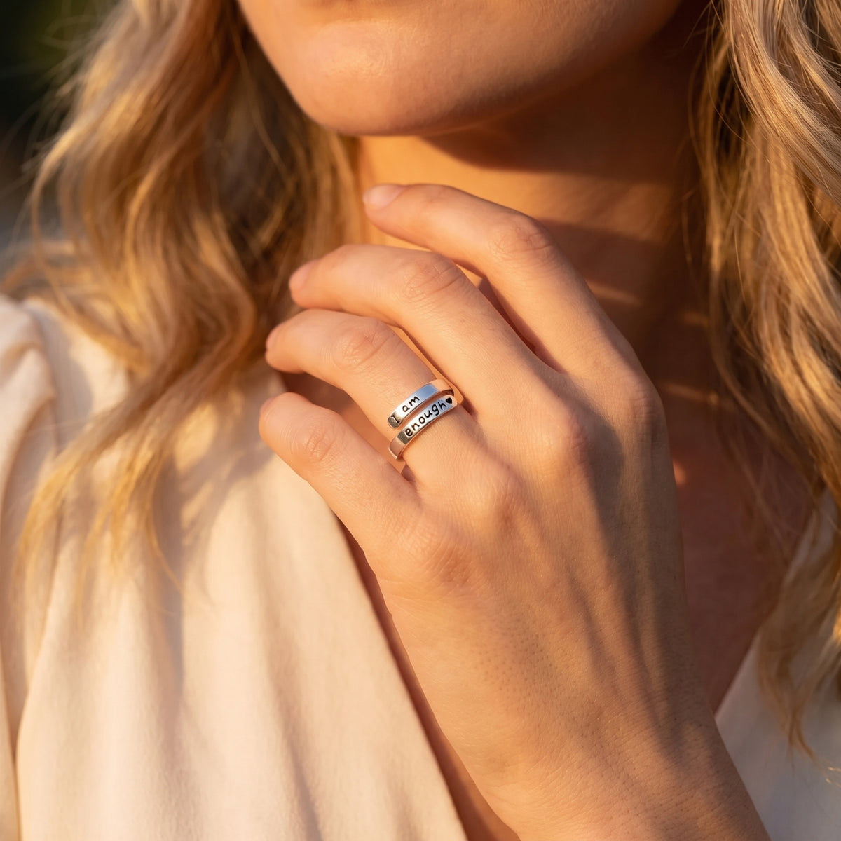 Silver I am enough Wrap Affirmation Ring worn on a finger