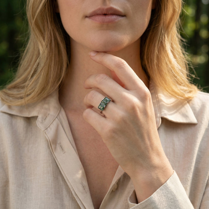 Model wearing the triple natural moss agate bar ring in S925 sterling silver on her ring finger.