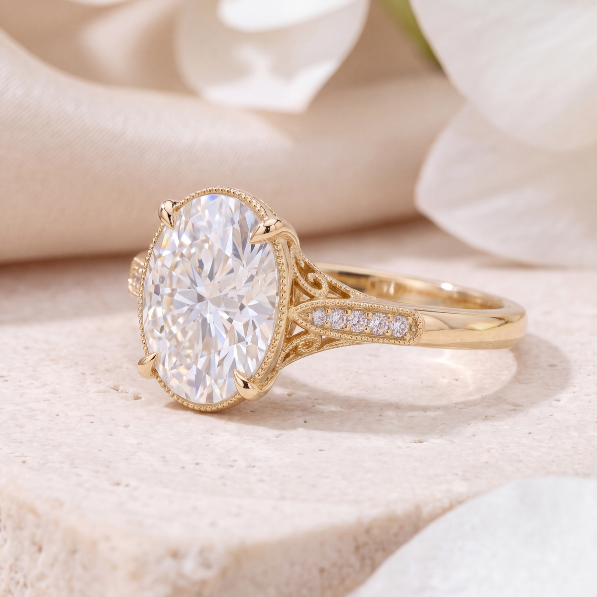 Angled profile shot highlighting the filigree side accent and milgrain details on the yellow gold ring.