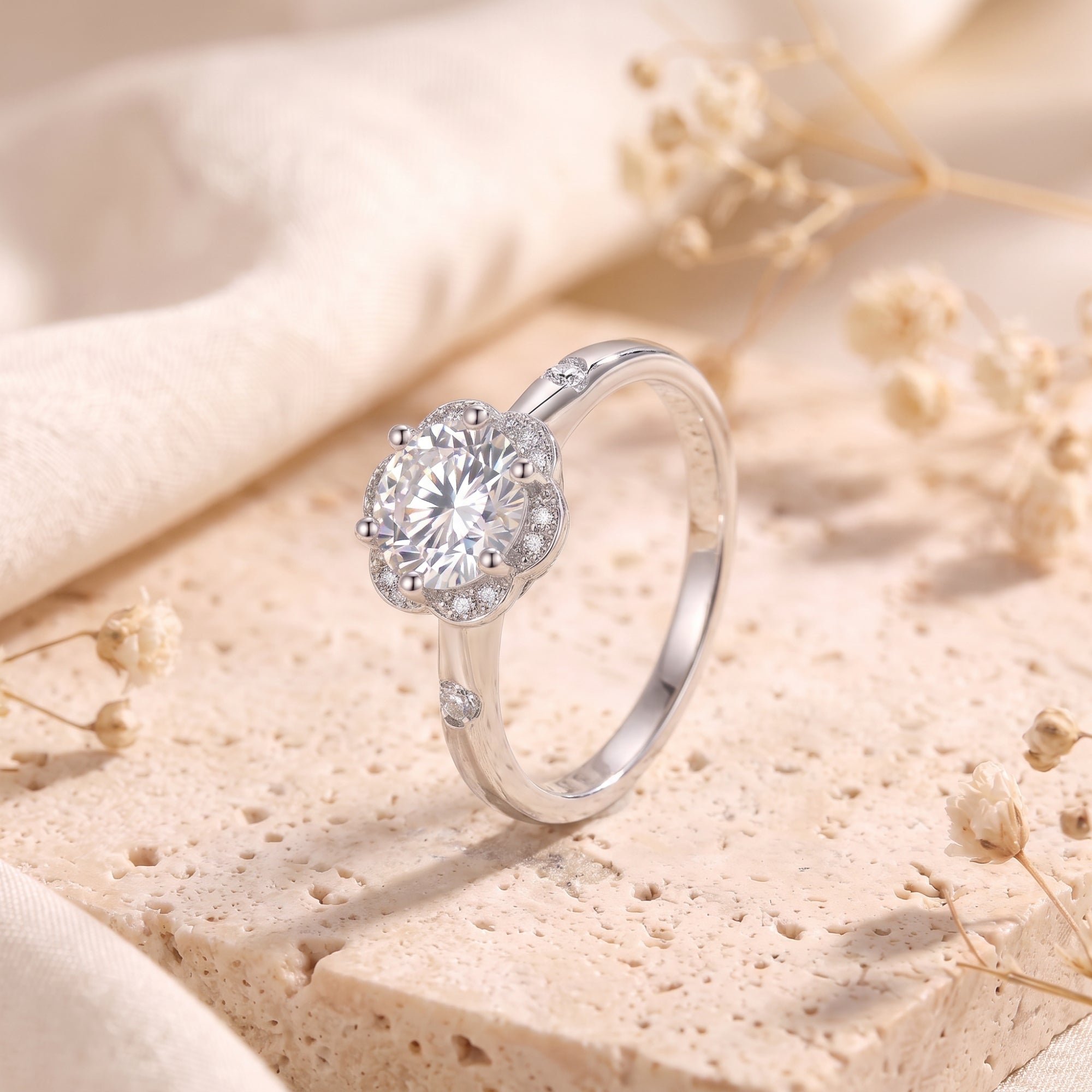 Angled view of the S925 silver Fleur Bloom ring with round-cut center stone.