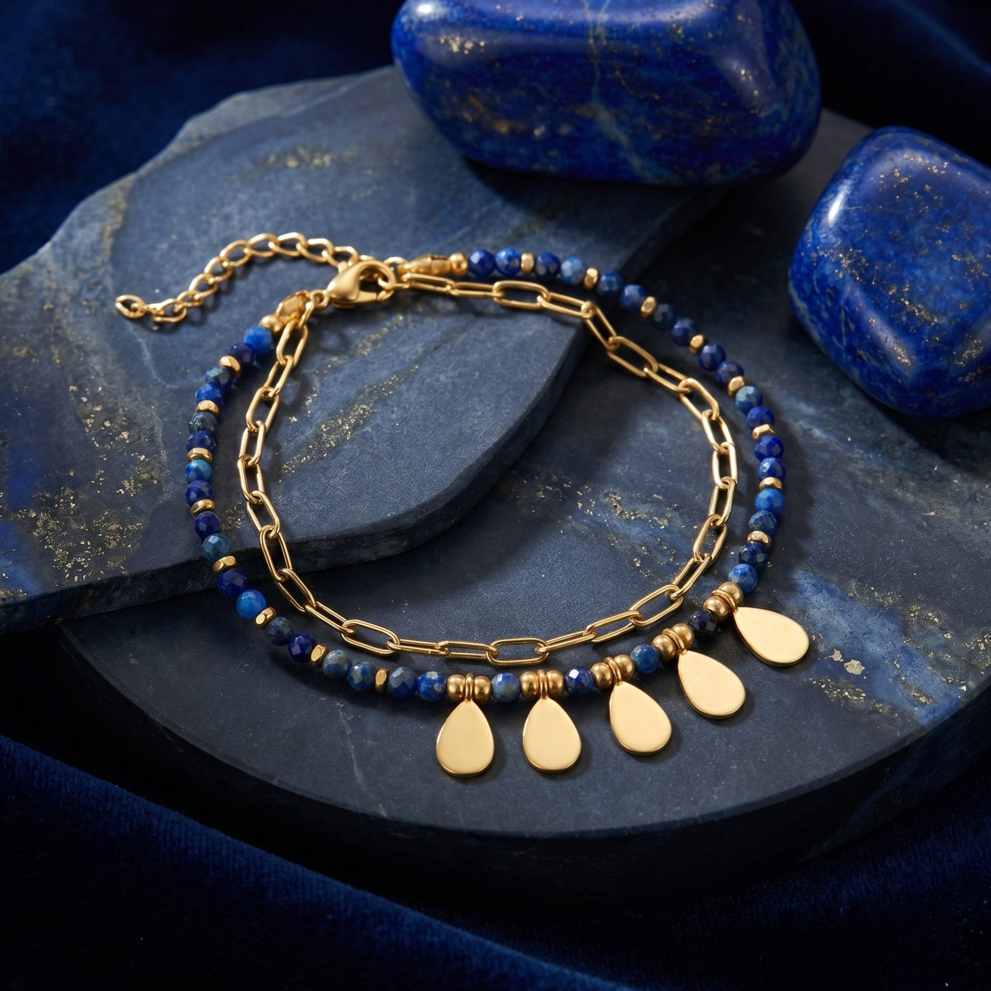Angled view of the Sylvan Leaf double-layered gold plated bracelet with faceted lapis beads and leaf charms.