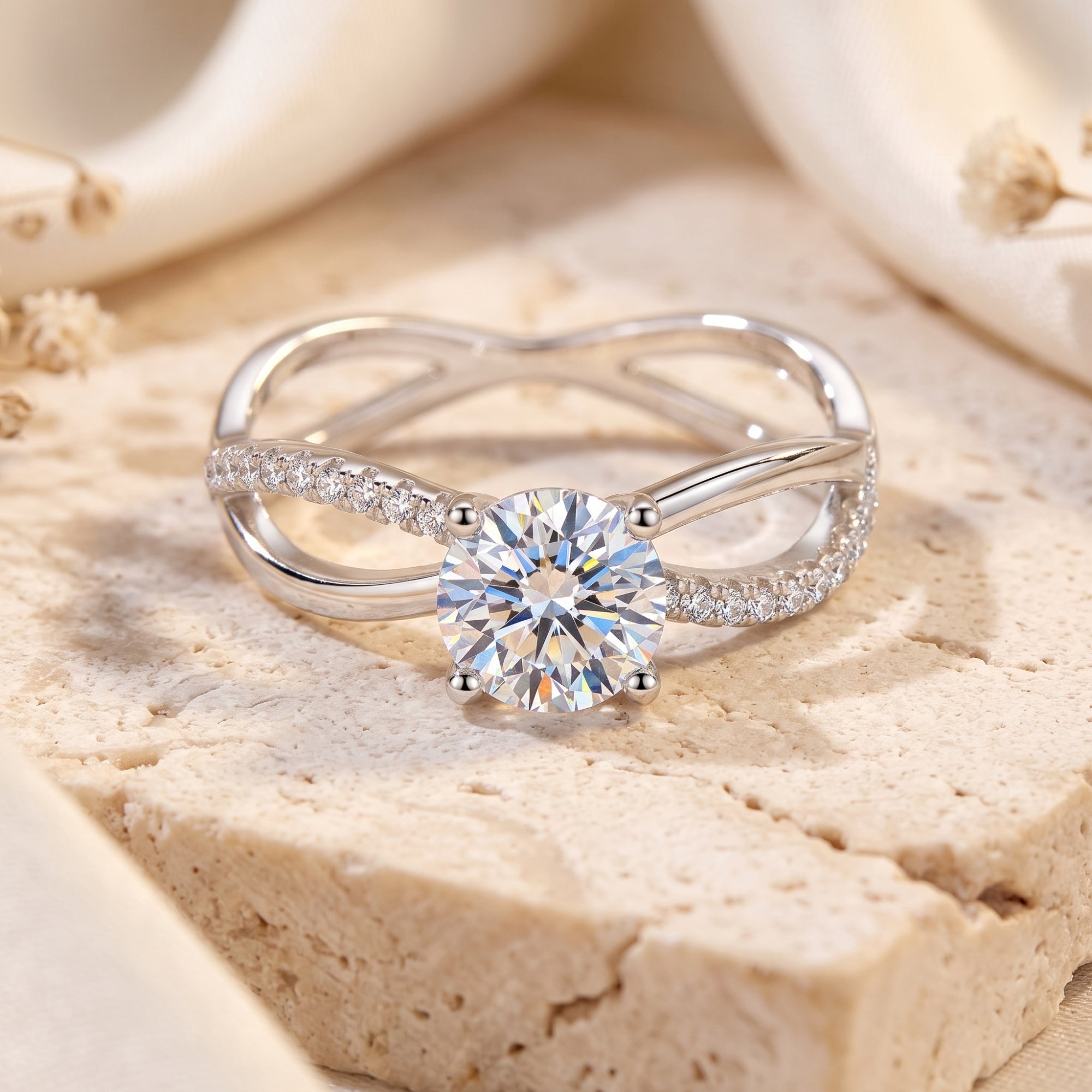 Macro view of a round cubic zirconia solitaire ring with crisscross band.