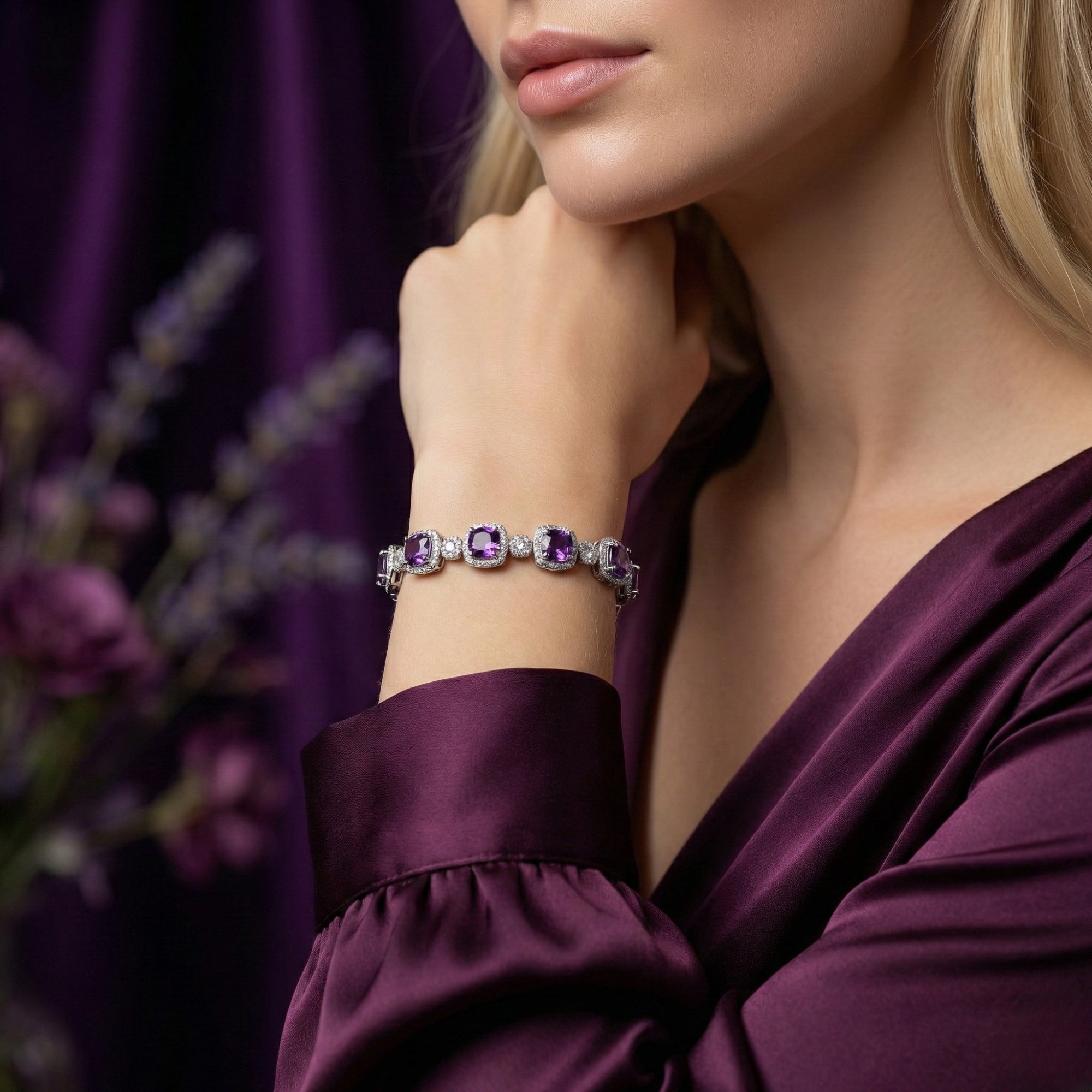 Woman wearing the cushion cut amethyst sterling silver bracelet on her wrist with a purple silk dress.