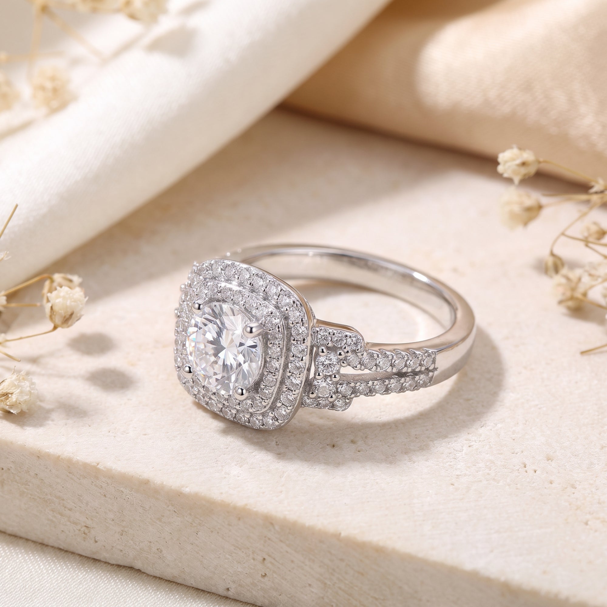 Close-up of a sterling silver cushion double halo ring and micro-pavé split-shank.