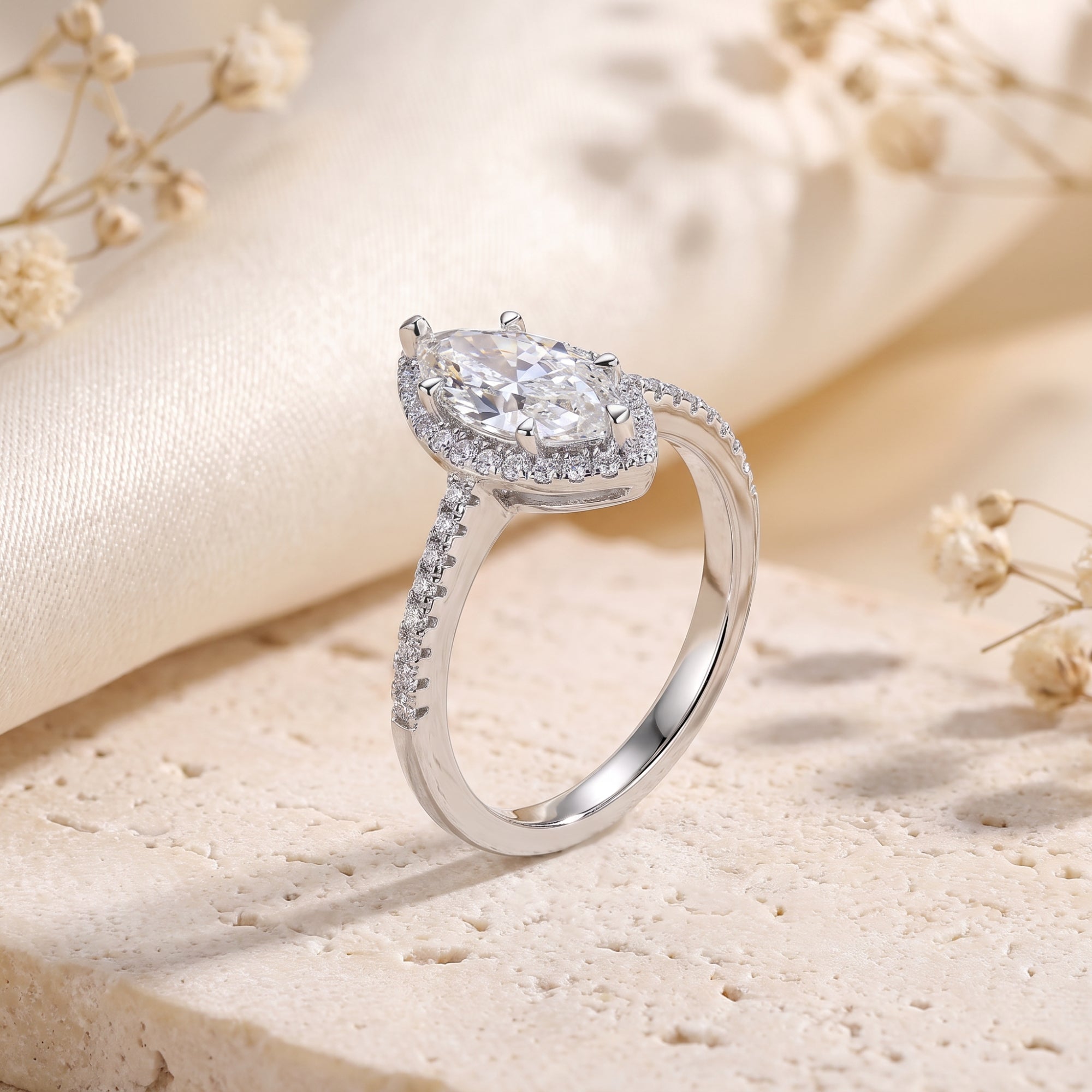 Side profile of the S925 sterling silver marquise halo ring showing the prong setting and micro-pavé band.