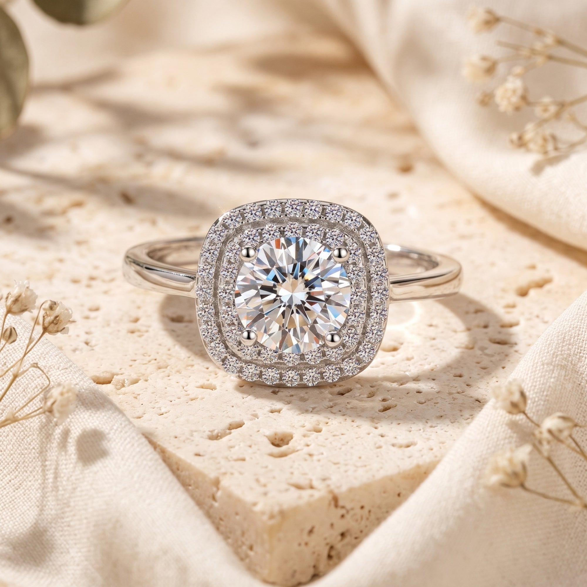 Close-up of a sterling silver double cushion halo ring featuring a 6.5mm round brilliant cubic zirconia.