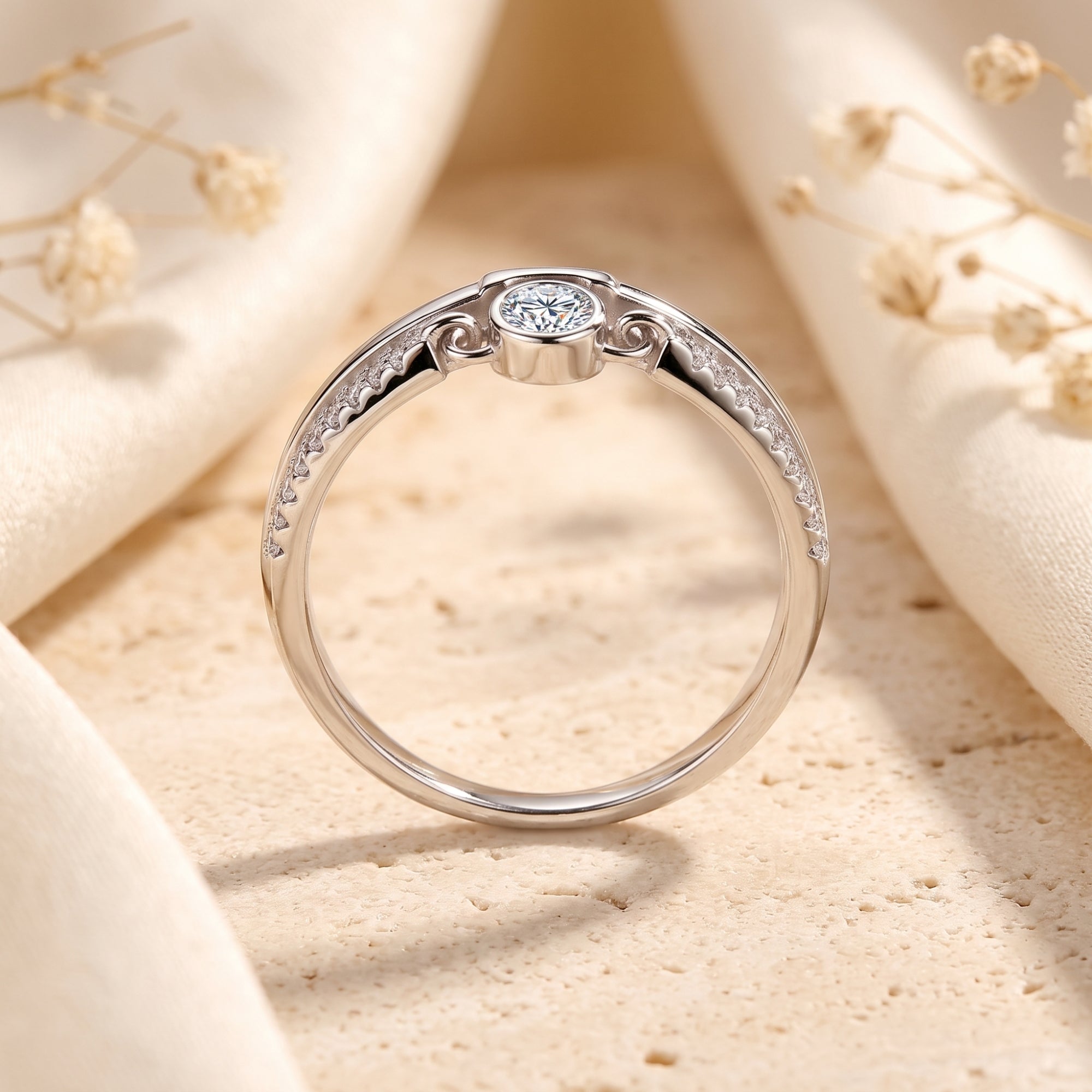 Side profile of the Lyra S925 silver ring showing the bezel-set round stone and dual-band design.
