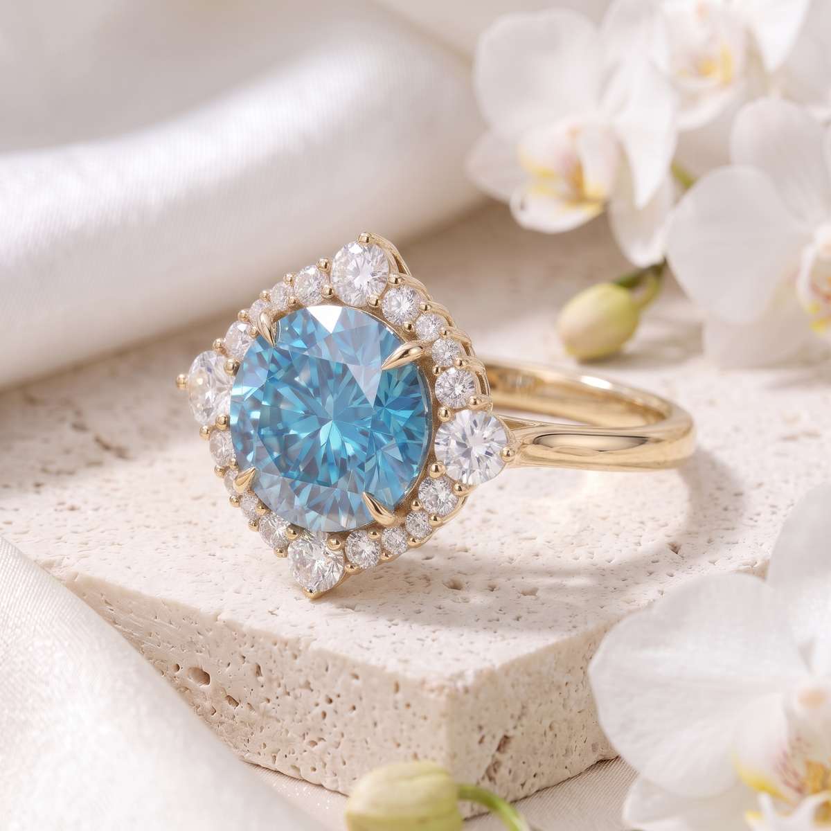 Angled view of a yellow gold engagement ring with round blue moissanite center stone and halo.