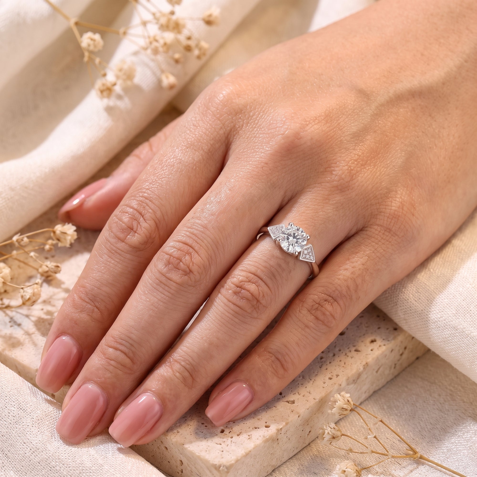 S925 silver Trinity geometric ring with round brilliant stone on model.