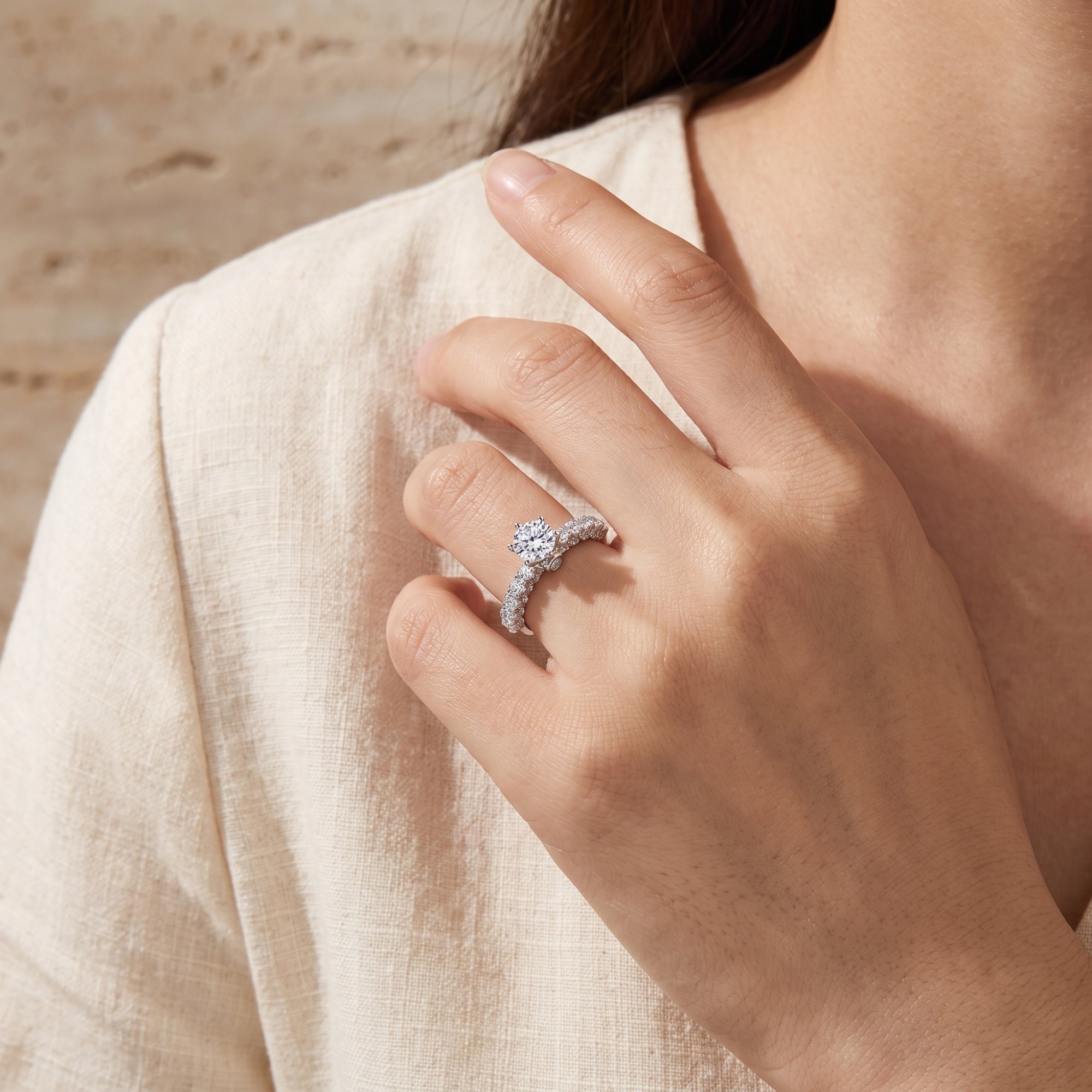 Model wearing the silver Regal Cathedral ring with a round-cut center stone.