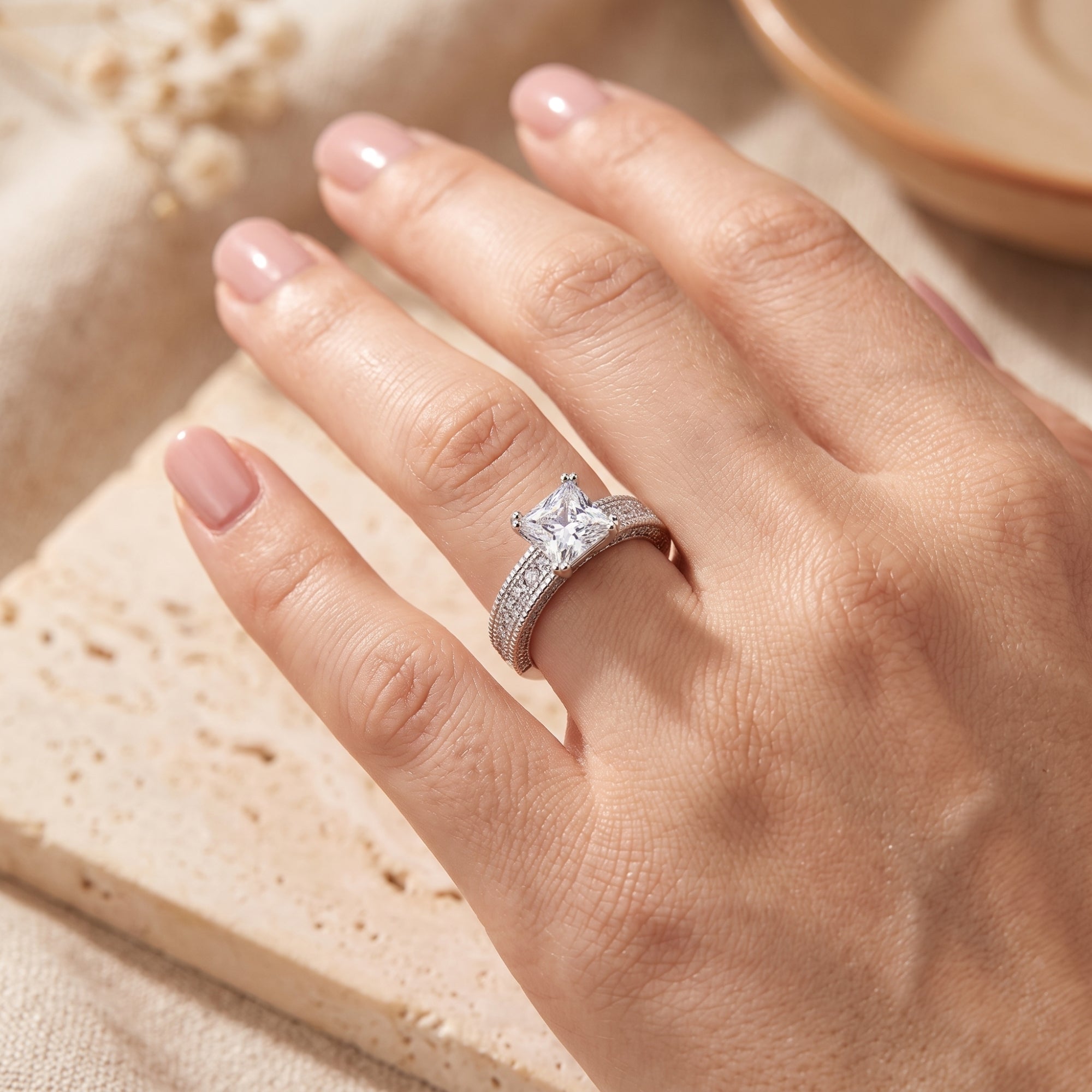 S925 silver princess cut ring on model's finger.