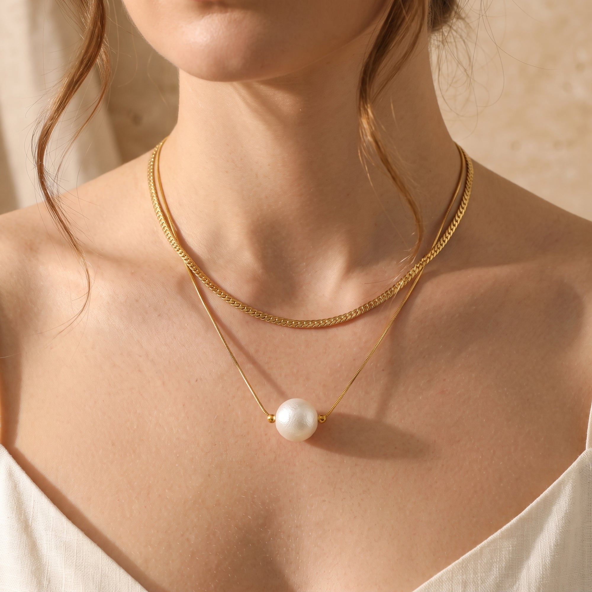El collar de perlas en capas