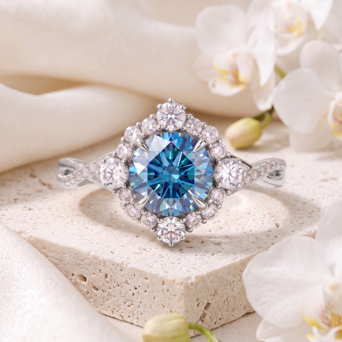 Front view of the white gold halo engagement ring featuring a brilliant blue moissanite and diamond halo.