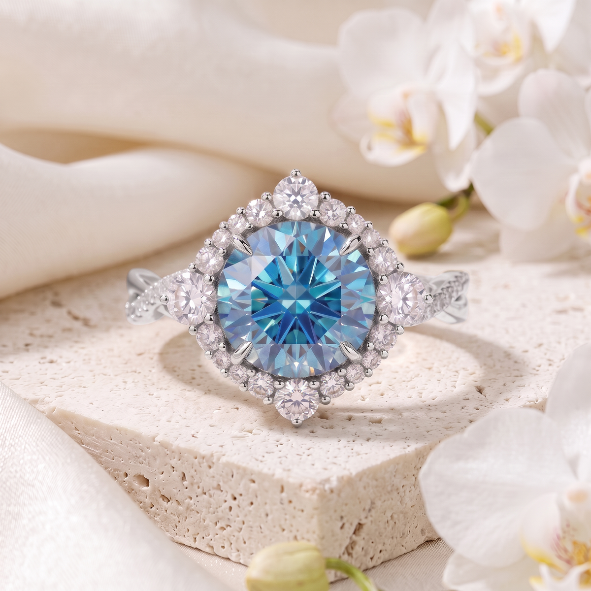Front view of a white gold blue moissanite halo ring.