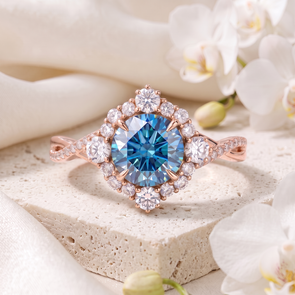 Front view of the rose gold halo engagement ring featuring a round blue moissanite and a vintage-inspired diamond halo.