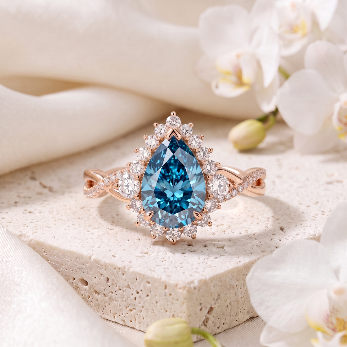 Pear cut blue moissanite halo engagement ring with an intertwined pave band in rose gold.