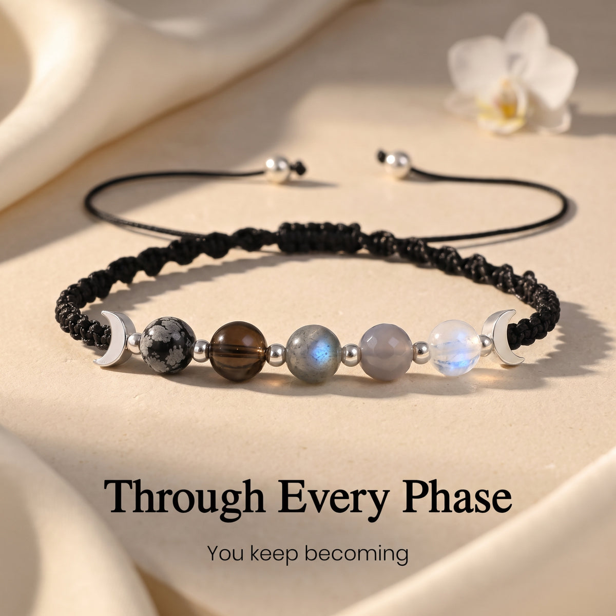Black moon-phase bracelet with Through Every Phase encouragement caption