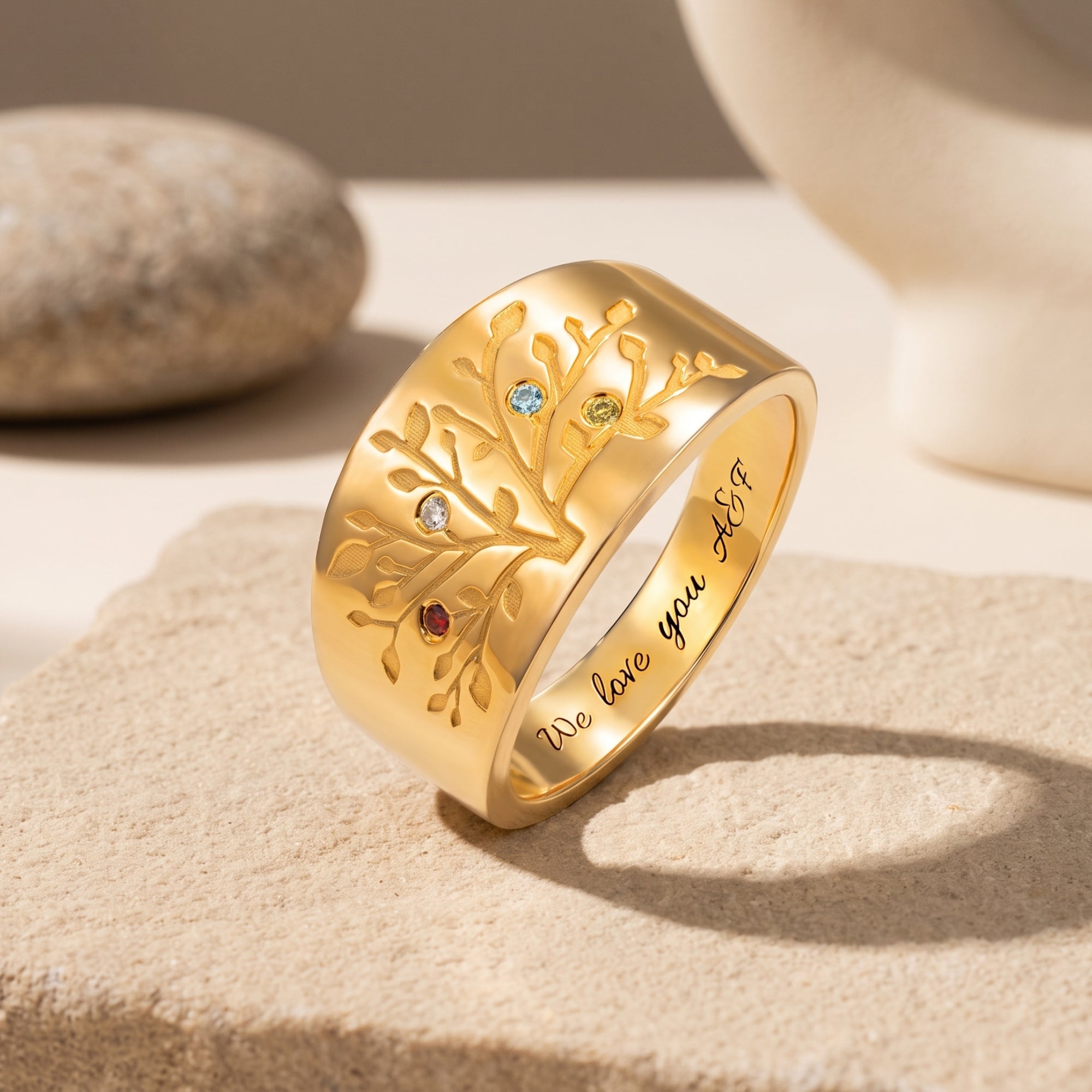 Personalized solid gold family tree ring with simulated birthstones.