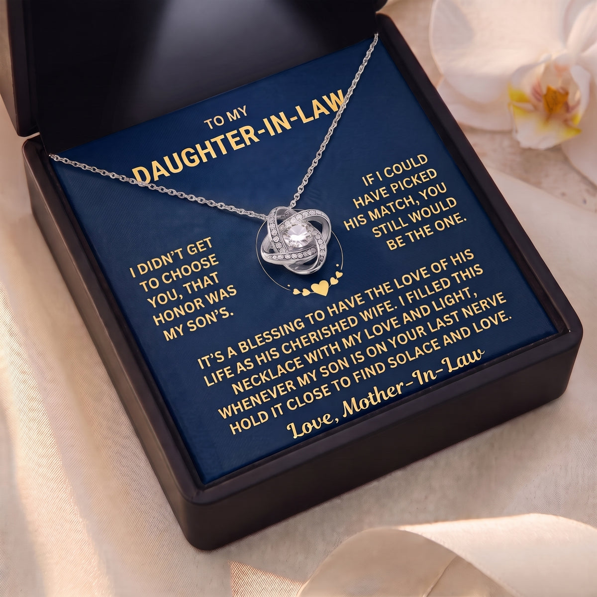 Silver love knot necklace over the Daughter-in-Law message card.