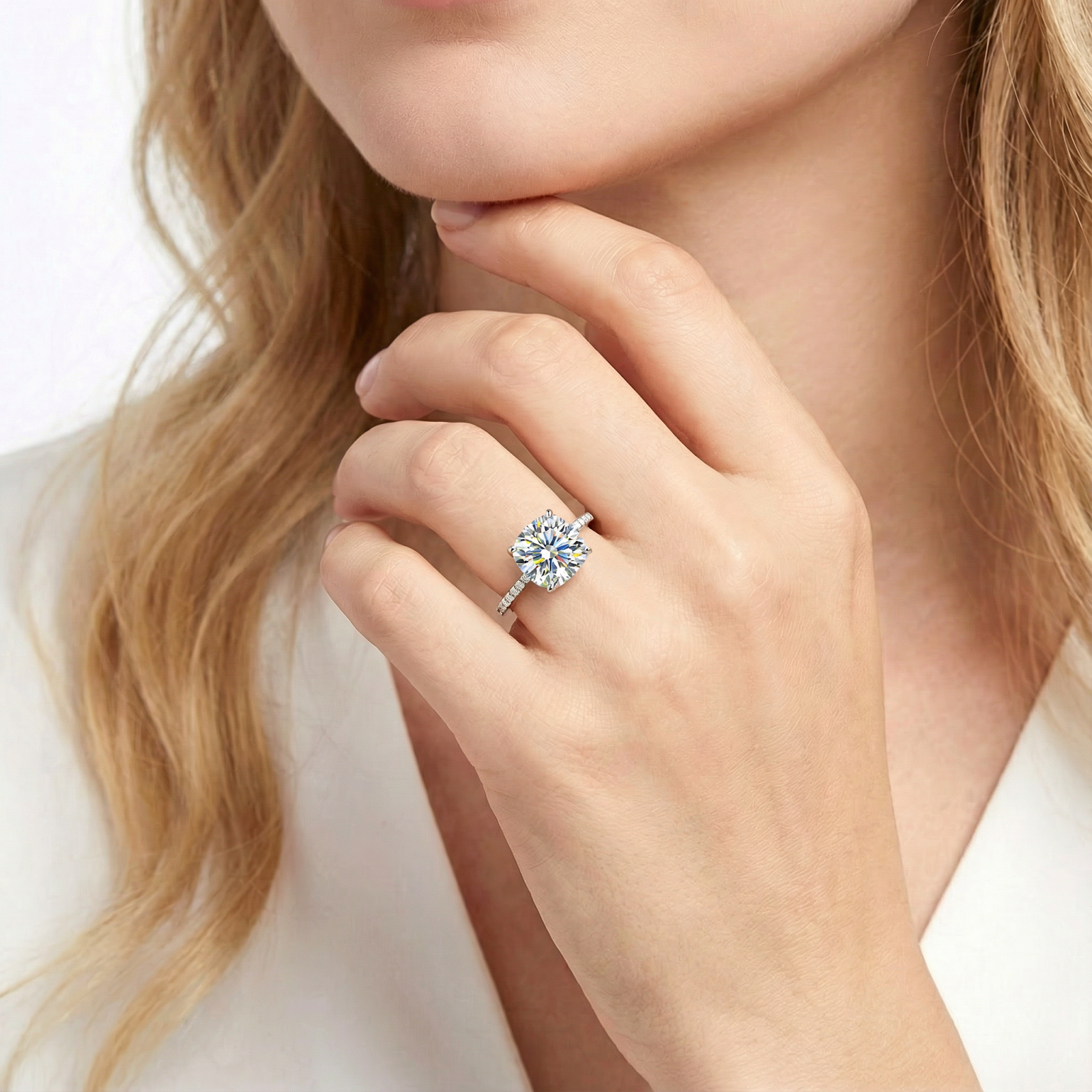 Model wearing the Celestina cushion cut zirconia ring in S925 sterling silver on her ring finger.
