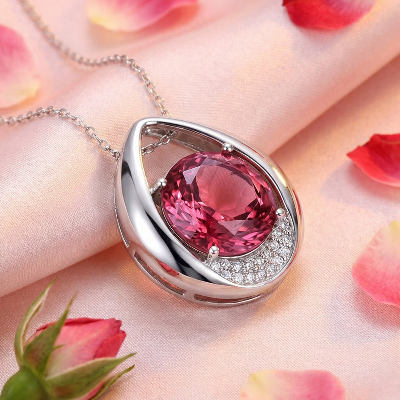 Close-up of the Valisara teardrop pendant's round simulated pink tourmaline and pavé accents in S925 sterling silver.