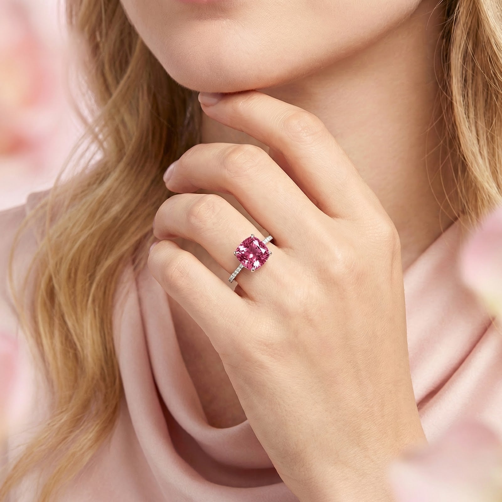 Model wearing the cushion-cut pink tourmaline sterling silver ring on her ring finger.