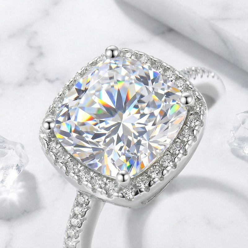 Macro detail of the cushion cut simulated diamond and halo setting on a sterling silver ring.