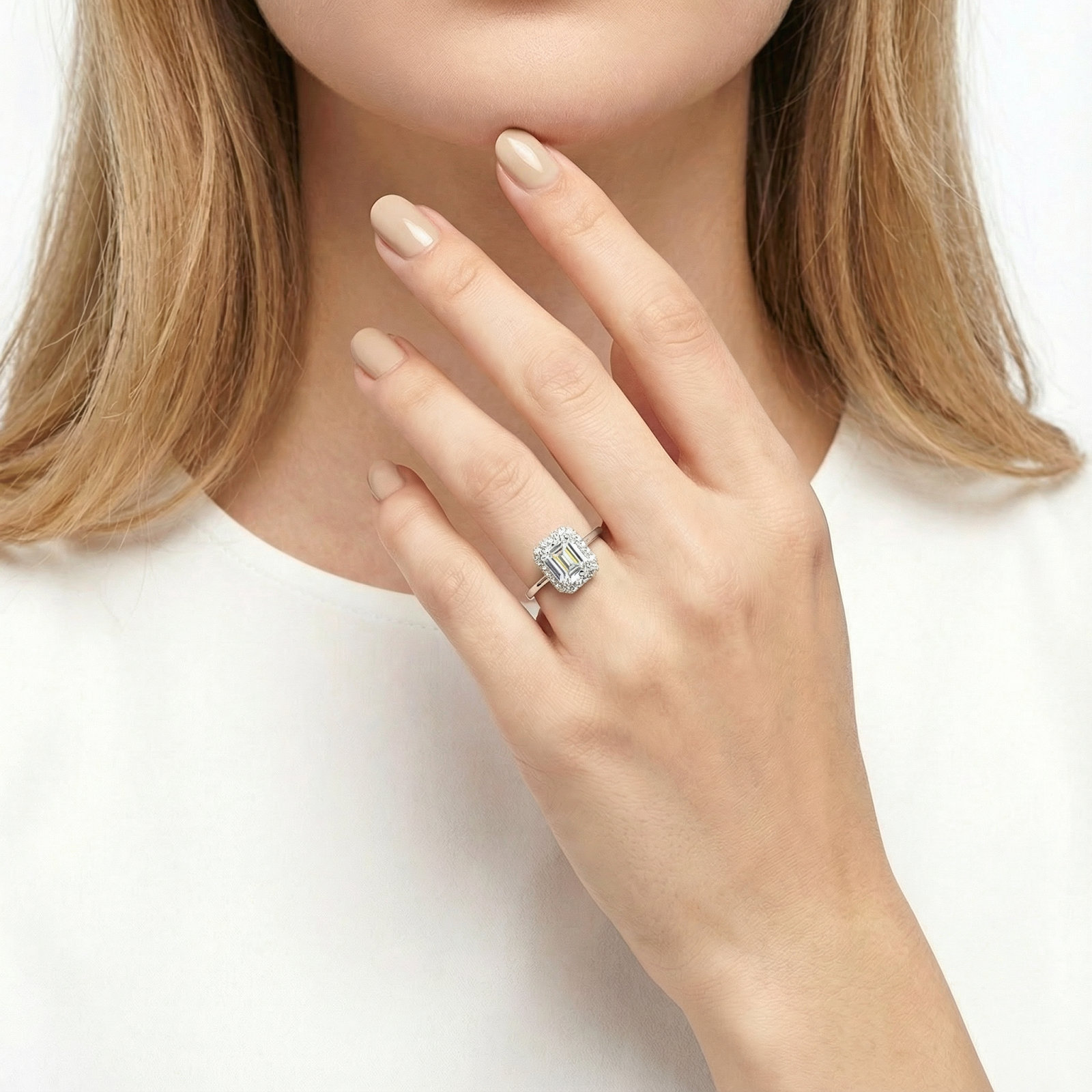 Model wearing the Elara radiant halo ring with an octagon-cut zirconia on her ring finger.
